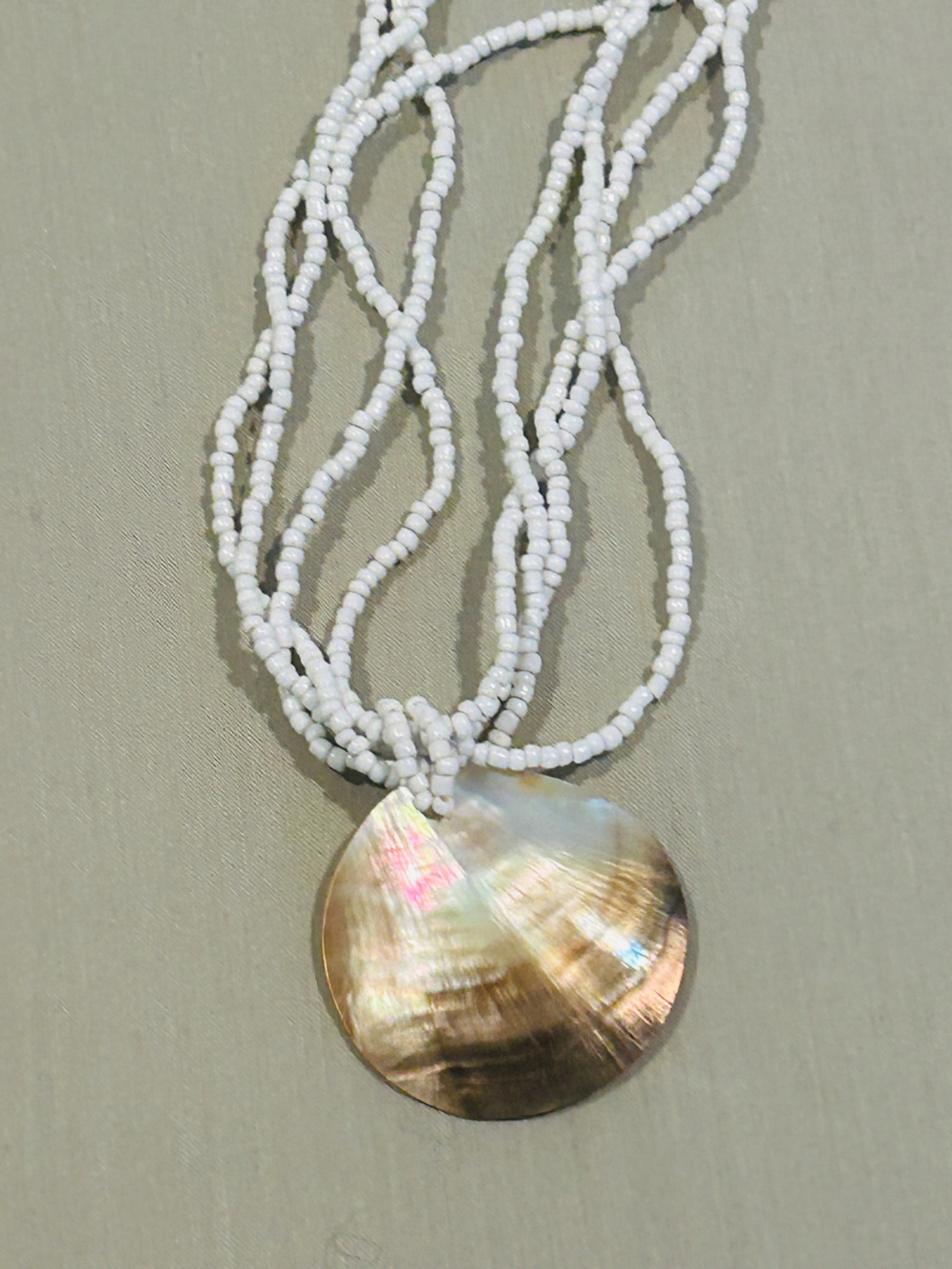 White Beaded Multi-Strand Necklace with Iridescent Shell Disk